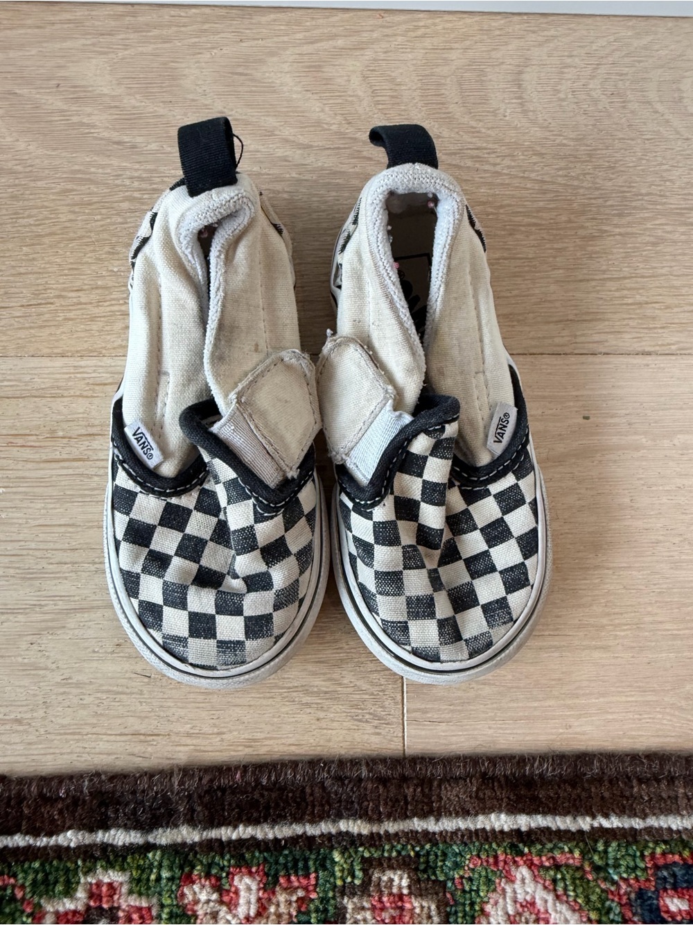 Vans Kids Checkerboard Slip-On Sneakers in Black and White